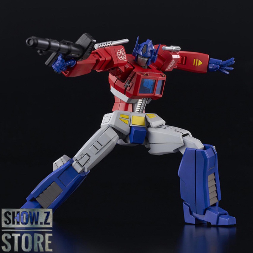 Optimus Prime posed with extended weapons and dynamic stance Optimus Prime posed with extended weapons and dynamic stance