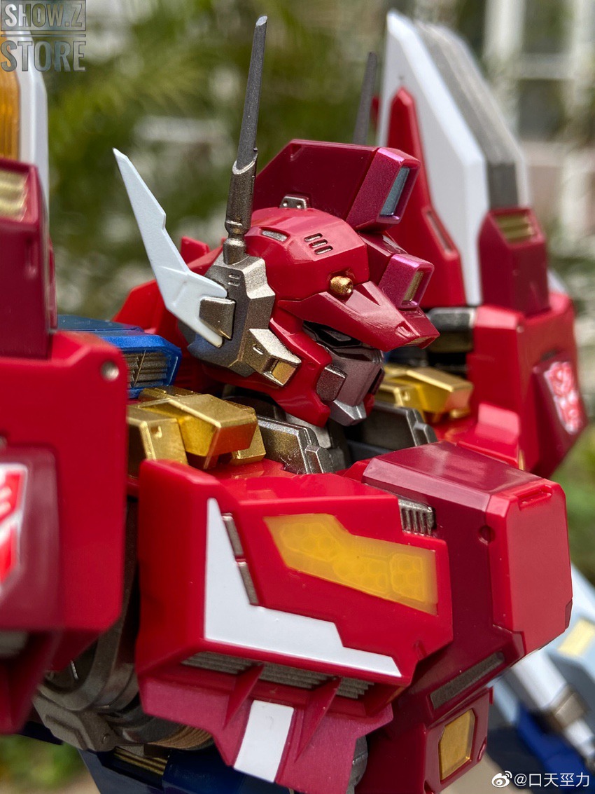 Gold transforming robot photographed with extended limbs and weapon articles Gold transforming robot photographed with extended limbs and weapon articles