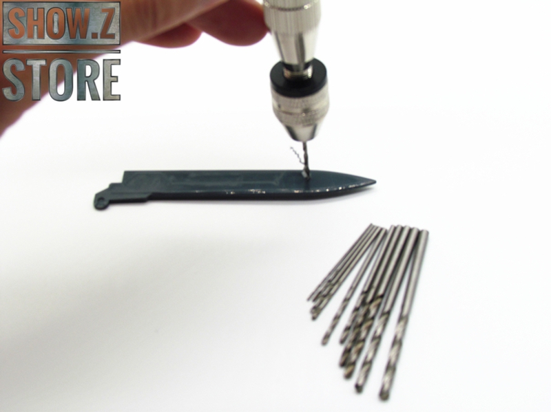 Hand drill demonstrating drilling action on dark material Hand drill demonstrating drilling action on dark material