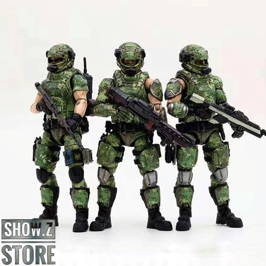 Three armed Russian military soldiers in green digital camouflage uniforms Three armed Russian military soldiers in green digital camouflage uniforms