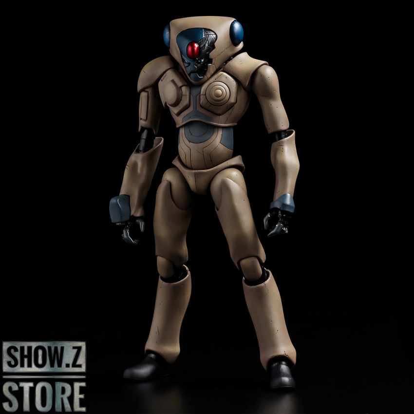 Tan and blue humanoid robot with red eyes standing straight Tan and blue humanoid robot with red eyes standing straight