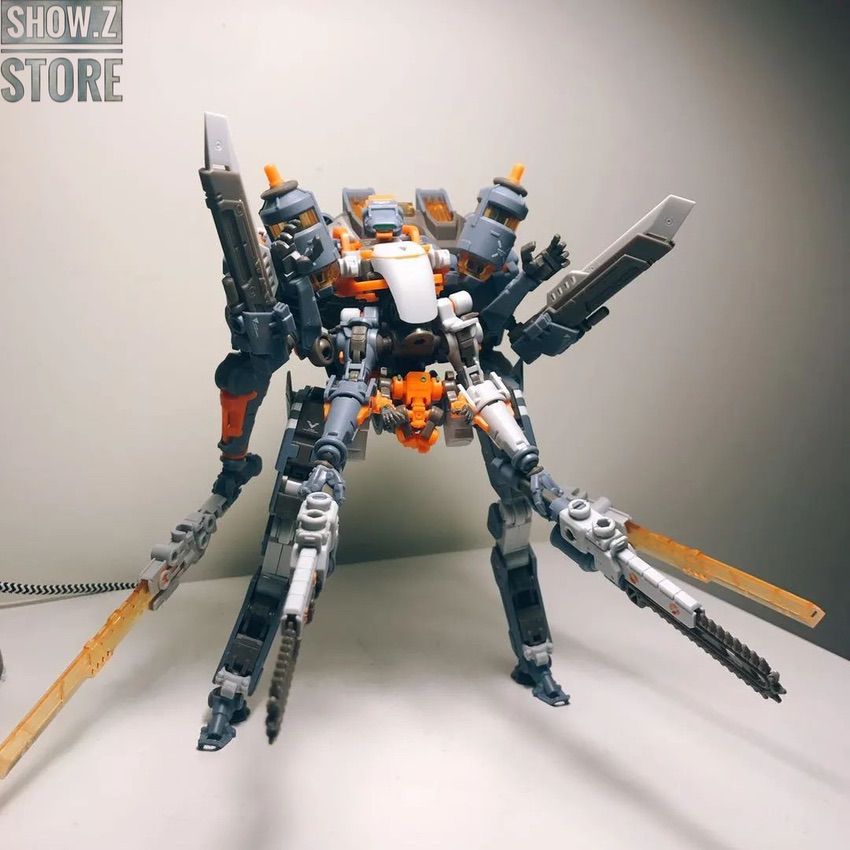 Orange white robot figure with serrated blade and multiple articulation joints Orange white robot figure with serrated blade and multiple articulation joints