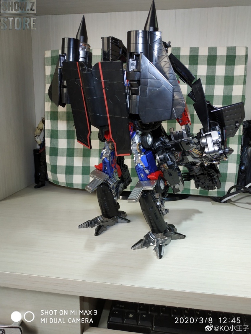 Aoyi oversized Jetfire mecha in action pose showing extended wing assembly Aoyi oversized Jetfire mecha in action pose showing extended wing assembly