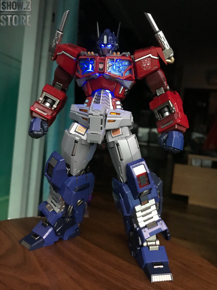 Gold robot figure with extended weapon arm positioned in standing pose Gold robot figure with extended weapon arm positioned in standing pose