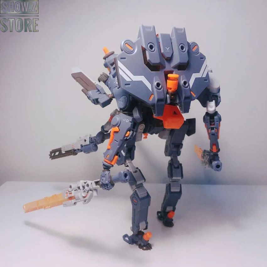 Gray and orange robot head close-up showing detailed facial features and weaponry Gray and orange robot head close-up showing detailed facial features and weaponry
