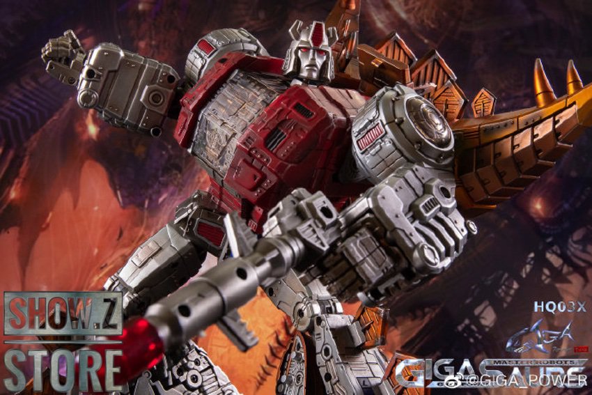 Red and silver armored robot with extended cannon arm weapon system Red and silver armored robot with extended cannon arm weapon system