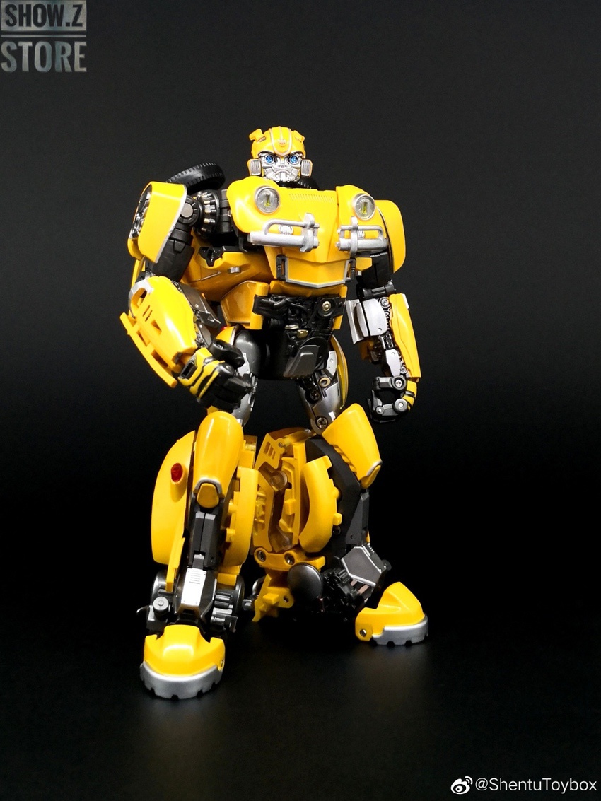 TE02 yellow and black Bumblebee robot posed standing on black background TE02 yellow and black Bumblebee robot posed standing on black background