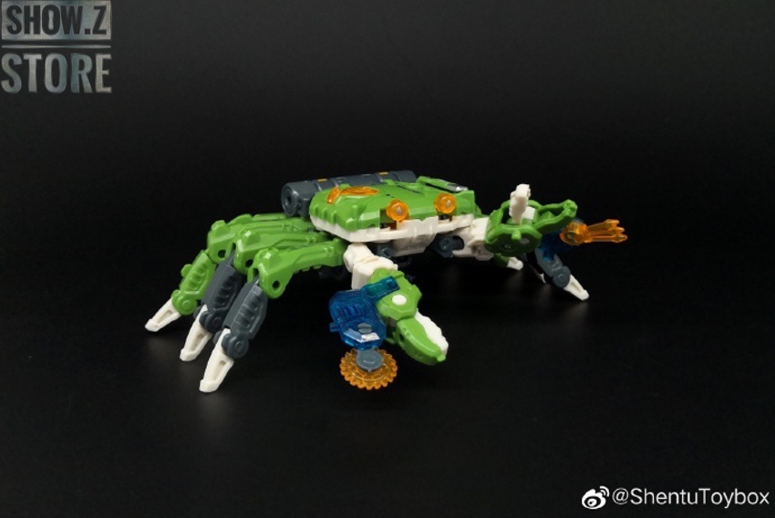 Green beast robot in standing pose showing transformation from animal mode Green beast robot in standing pose showing transformation from animal mode