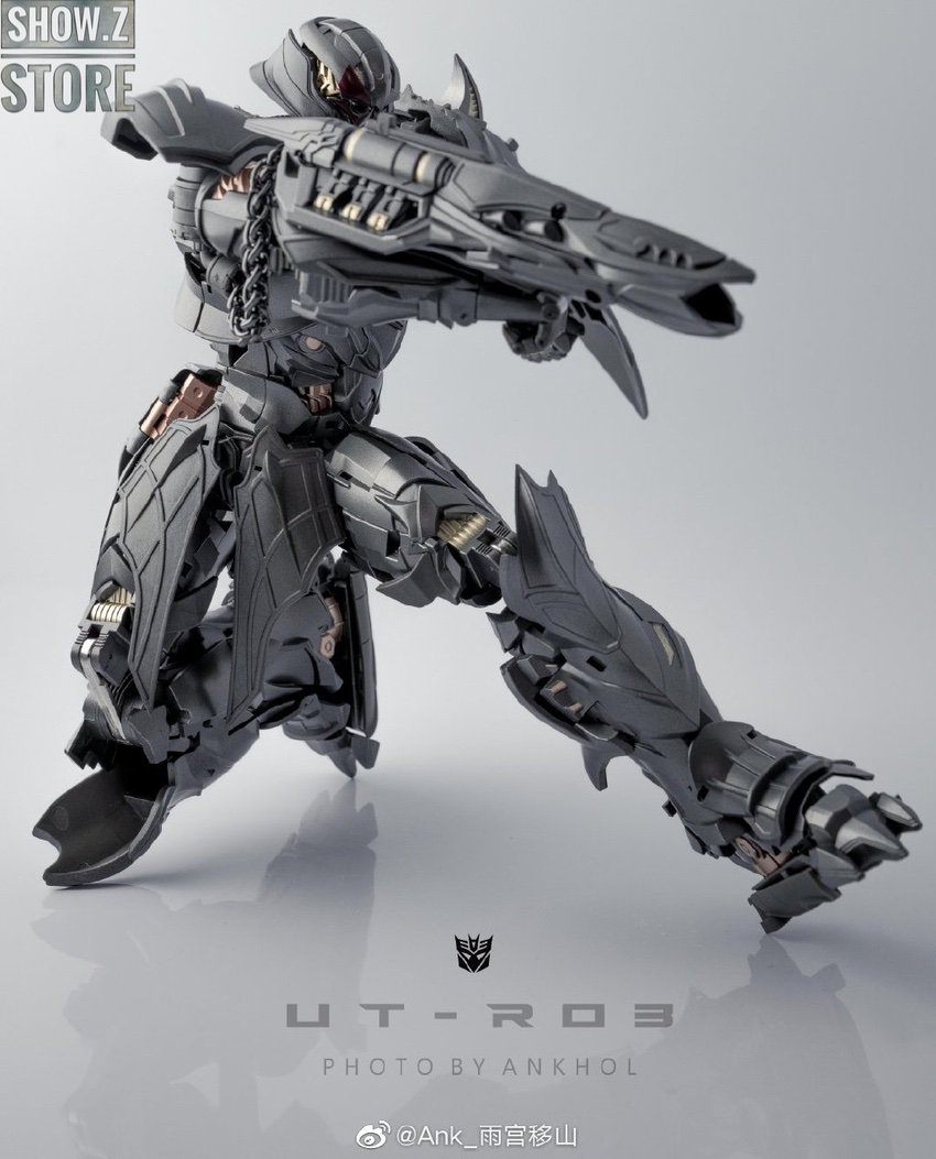 Black robot with extended weapon system in aggressive pose Black robot with extended weapon system in aggressive pose