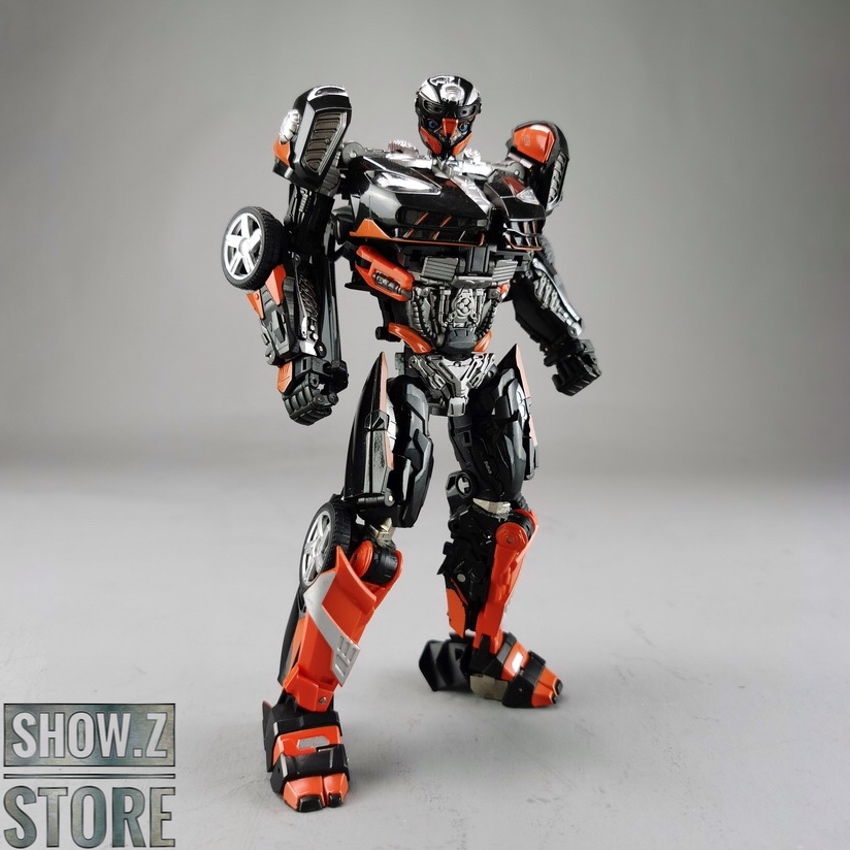 Black and orange hot rod robot with extended arms Black and orange hot rod robot with extended arms