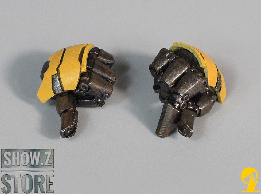 Close-up detail of yellow armored fist component Close-up detail of yellow armored fist component