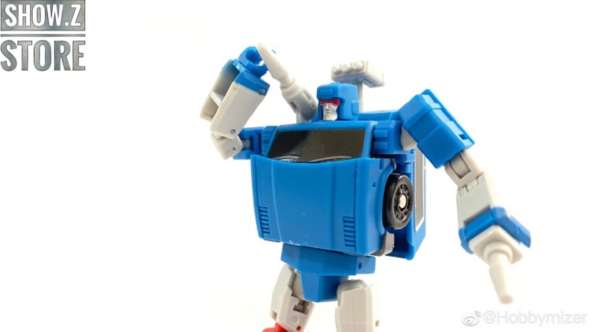 Blue robot transforming from vehicle mode showing articulated joints Blue robot transforming from vehicle mode showing articulated joints
