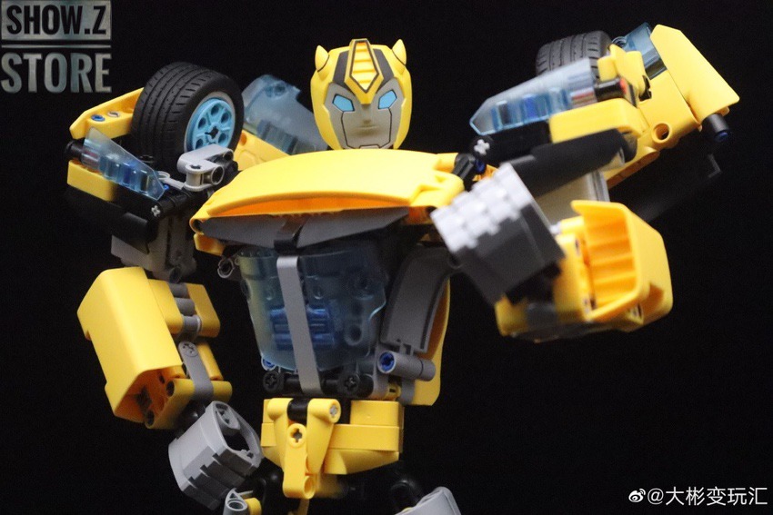 Yellow robot figure with extended arms display Yellow robot figure with extended arms display