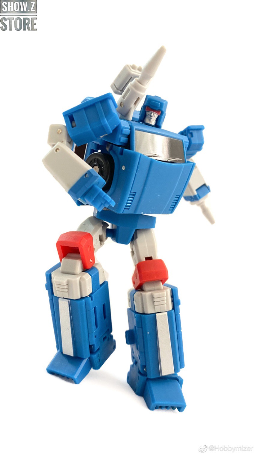 Blue robot mid-transformation from vehicle to robot form Blue robot mid-transformation from vehicle to robot form