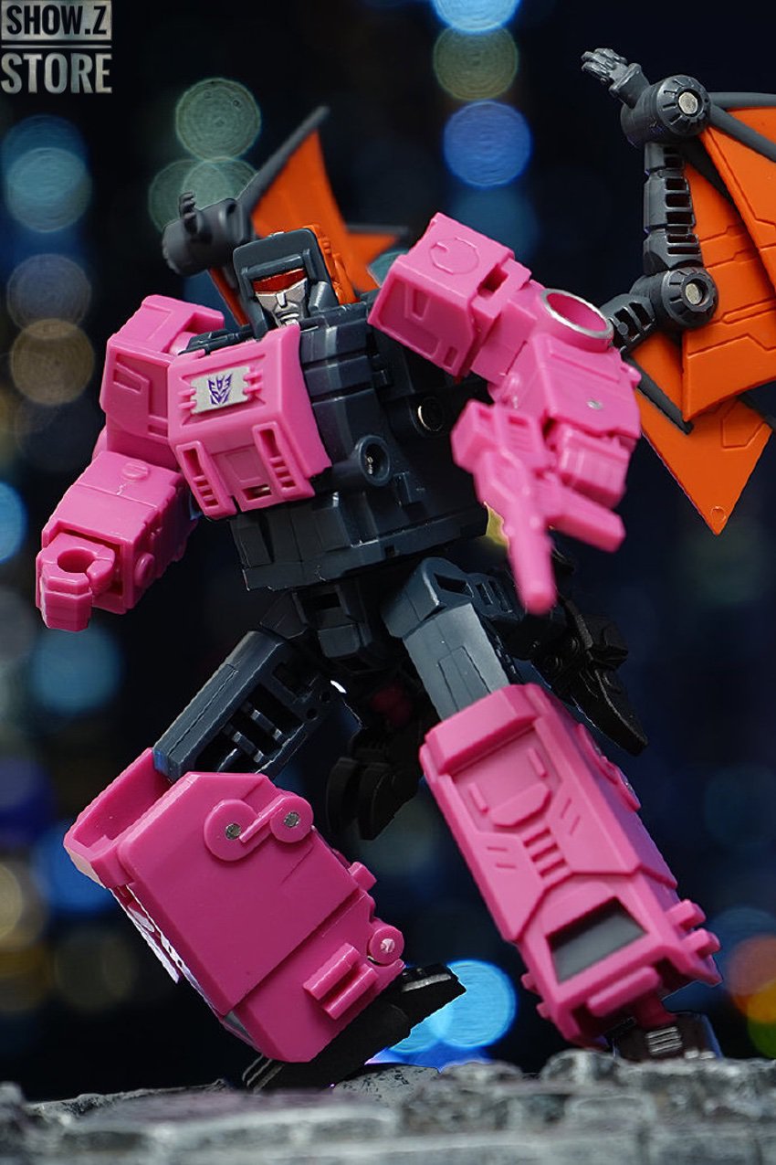 Pink and orange bat-winged transformer robot with extended wings Pink and orange bat-winged transformer robot with extended wings