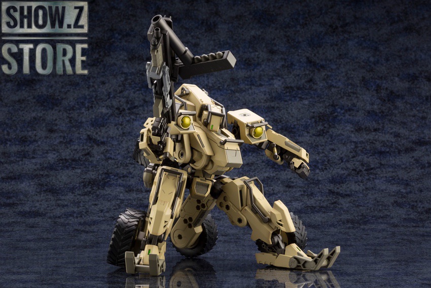 Tan military mecha figure in defensive stance Tan military mecha figure in defensive stance