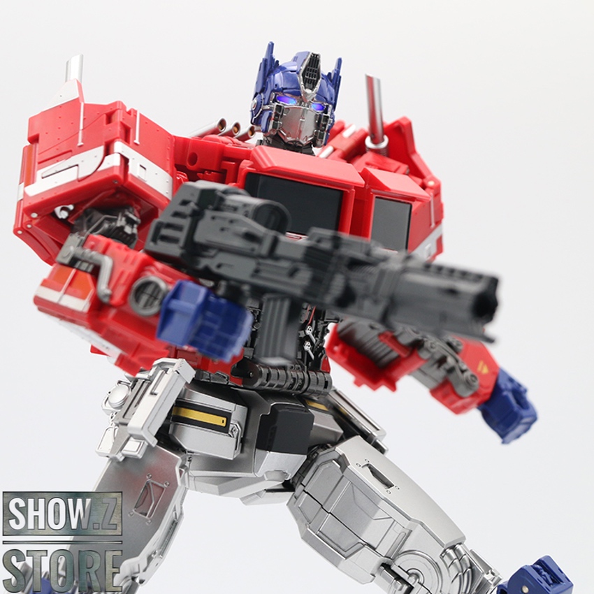 Red and blue robot standing in full transformation mode with weapons Red and blue robot standing in full transformation mode with weapons