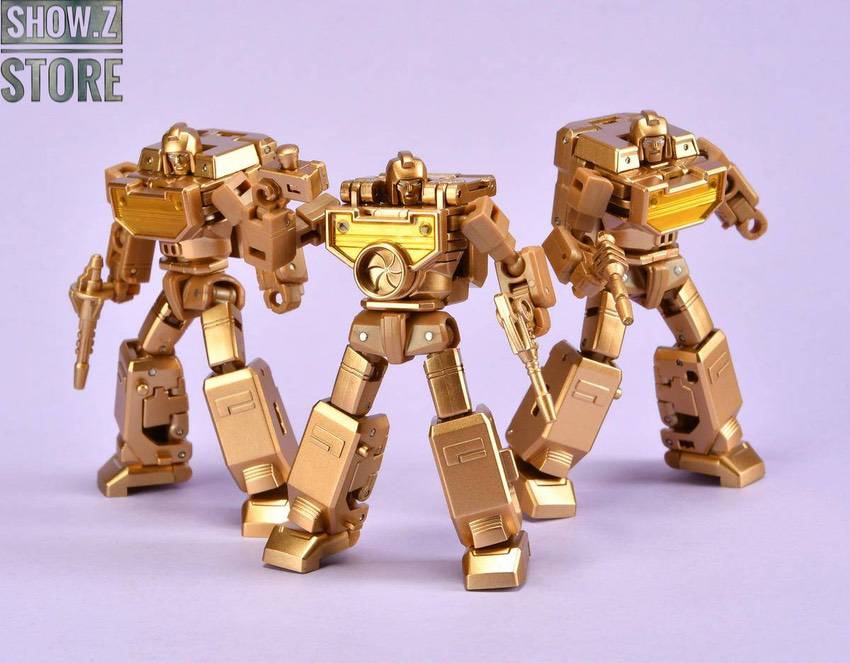 NewAge Reflector gold robot in three poses showing articulation NewAge Reflector gold robot in three poses showing articulation