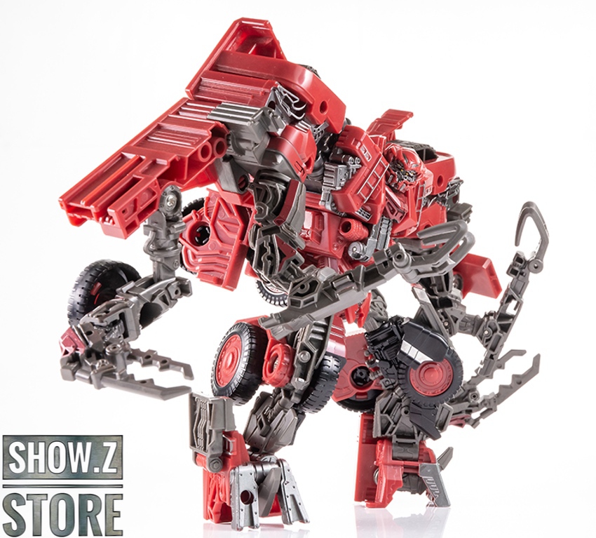 Red and black crab-like robot with golden wheels and excavator arm Red and black crab-like robot with golden wheels and excavator arm