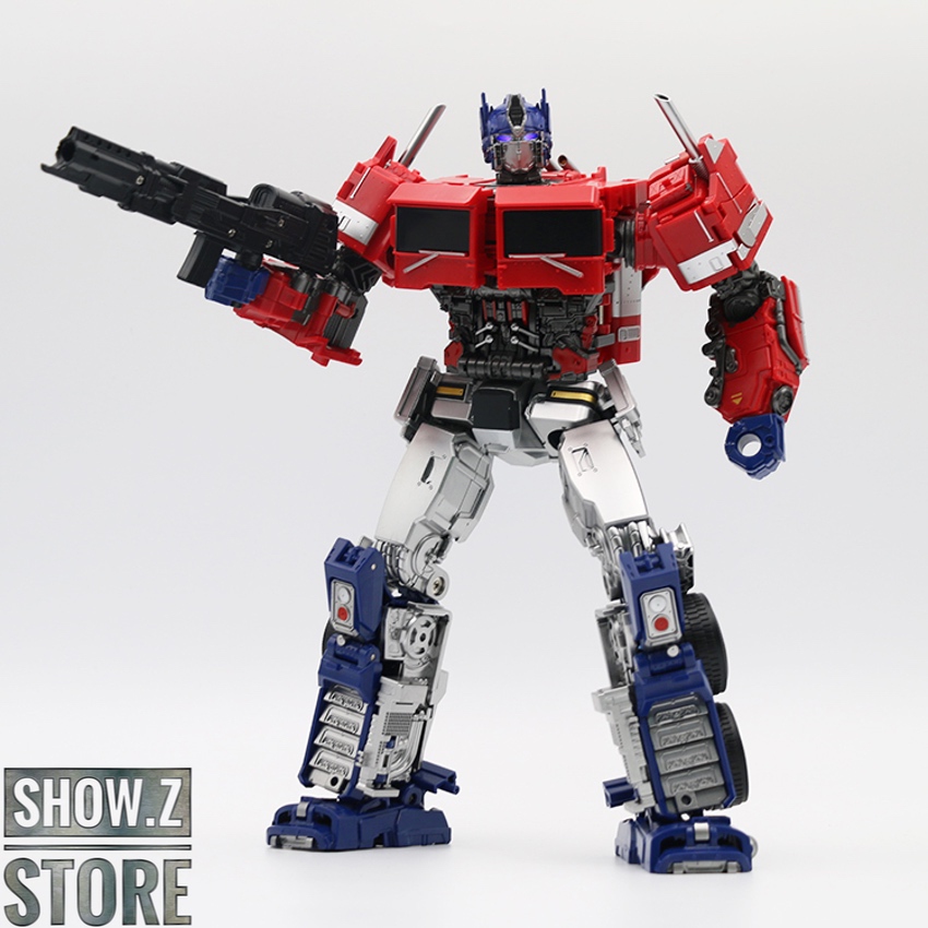 Red robot holding black large cannon weapon in both hands Red robot holding black large cannon weapon in both hands