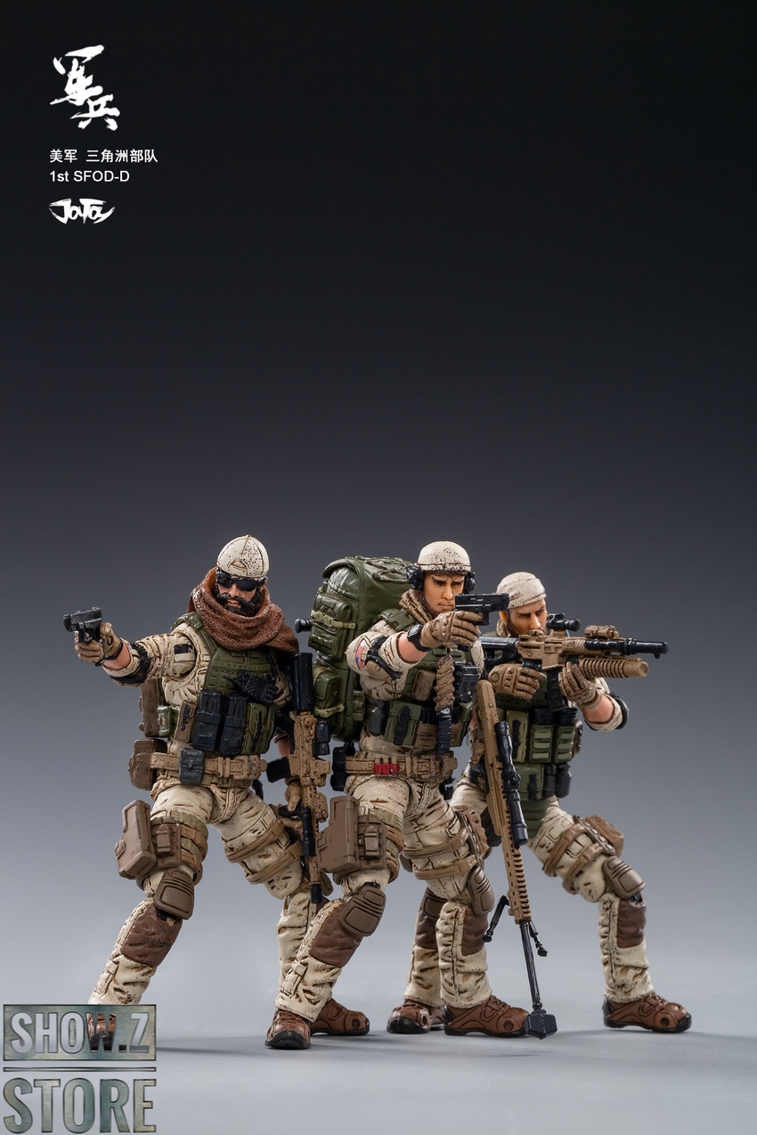 Four Delta Force soldiers armed and ready in tactical formation with weapons Four Delta Force soldiers armed and ready in tactical formation with weapons