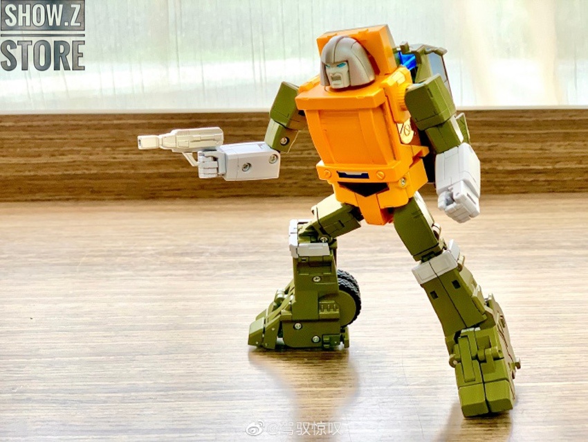 Orange green robot striking dynamic action fighting stance Orange green robot striking dynamic action fighting stance