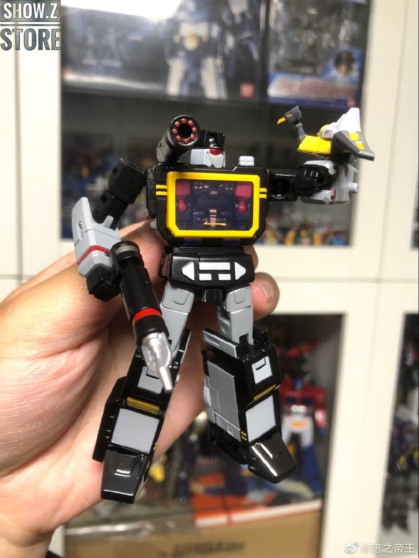 Black robot showing cassette mini figure accessories transformation Black robot showing cassette mini figure accessories transformation