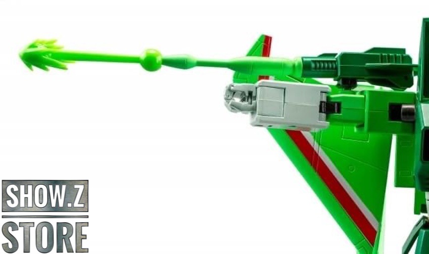 Green transformer figure with extended weapons and leg spread stance Green transformer figure with extended weapons and leg spread stance