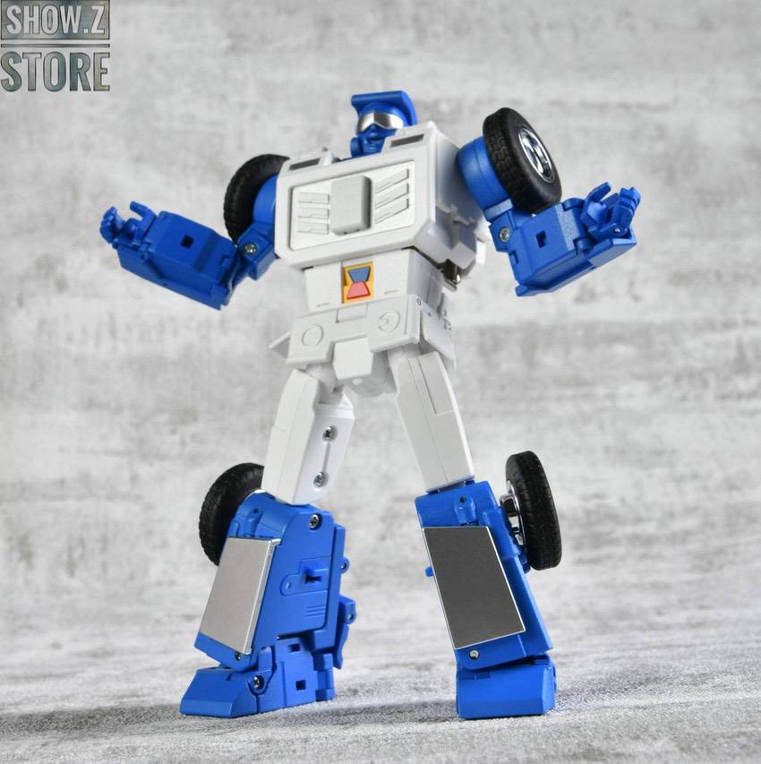 Blue white robot standing with wheels in vehicle stance Blue white robot standing with wheels in vehicle stance
