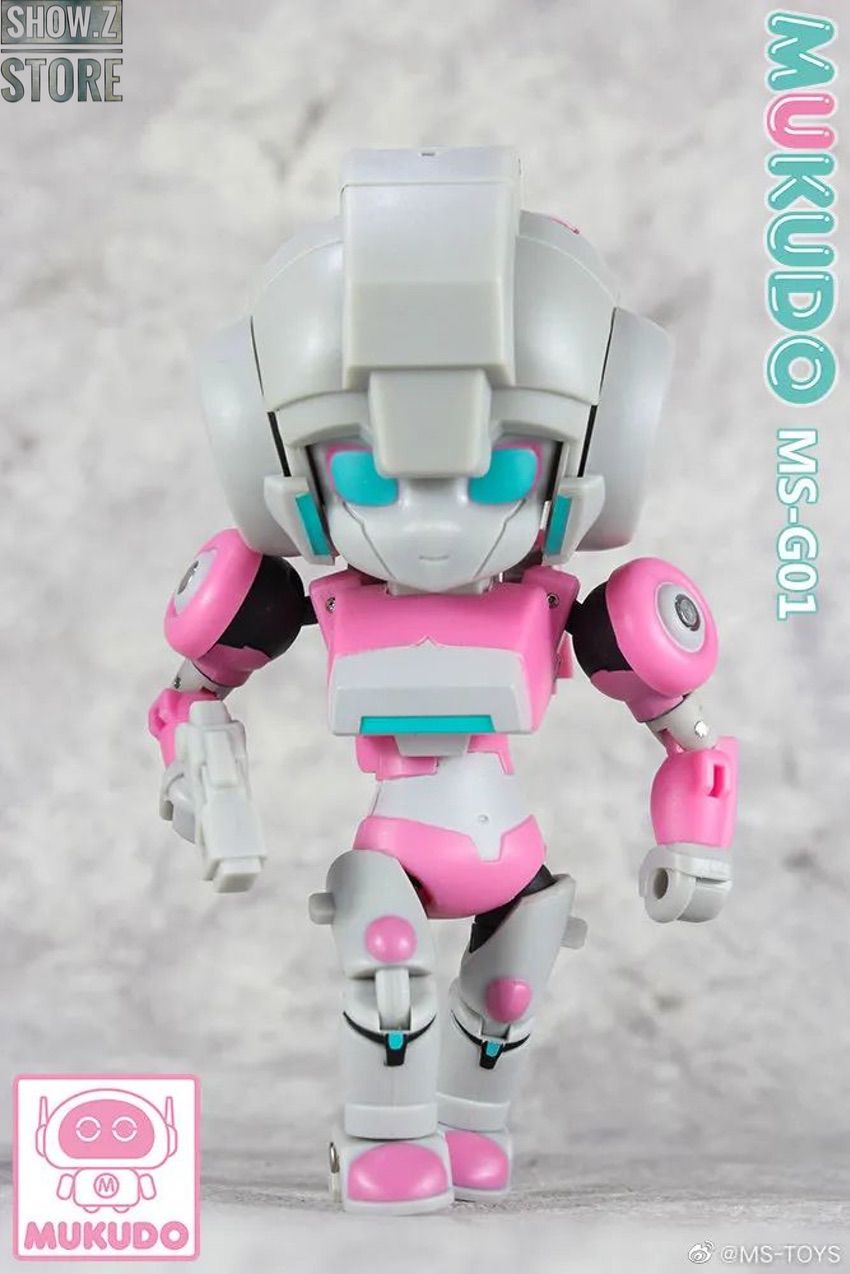 Cute pink and white chibi robot with cyan accents standing upright Cute pink and white chibi robot with cyan accents standing upright