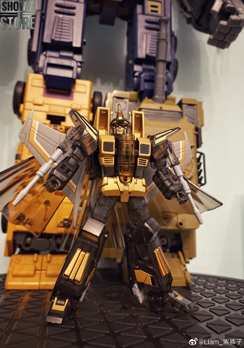 Black robot with gold accents and dual wing blades extended Black robot with gold accents and dual wing blades extended