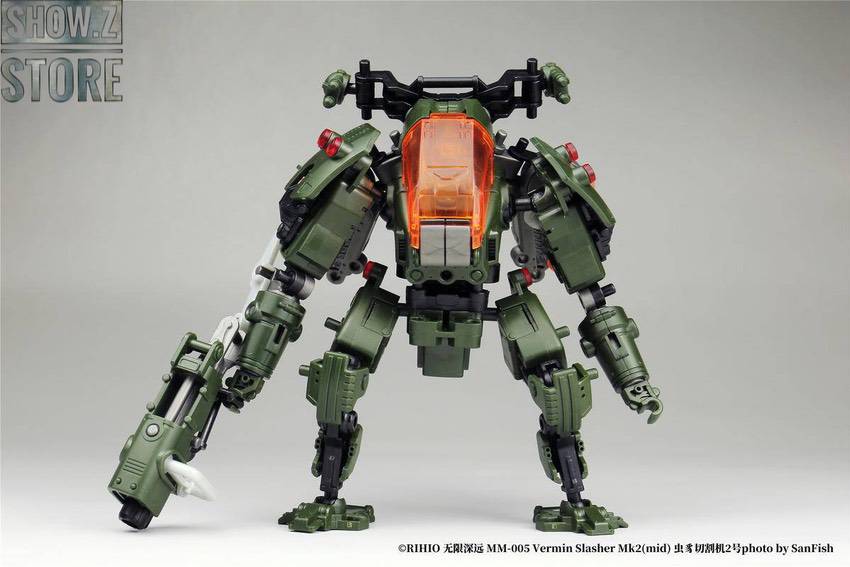 Green and orange MM005 Vermin Slasher robot with dual weapons Green and orange MM005 Vermin Slasher robot with dual weapons