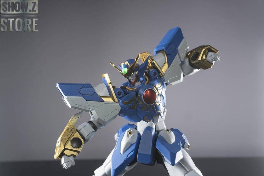 Blue white super robot Gravion Zwei standing with weapons ready Blue white super robot Gravion Zwei standing with weapons ready