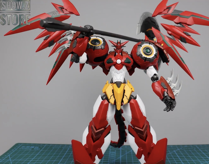 Red robot standing on display with extended weapon systems Red robot standing on display with extended weapon systems