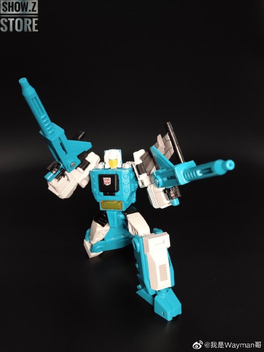 Cyan white blue robot in standing pose with weapons Cyan white blue robot in standing pose with weapons