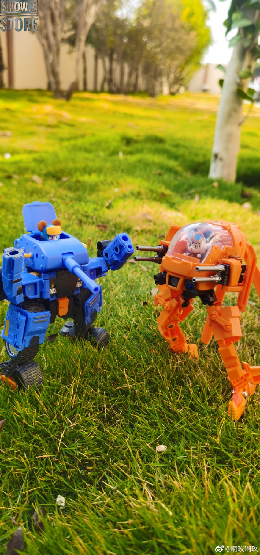 Two CA-03 variants blue orange facing off grass backdrop Two CA-03 variants blue orange facing off grass backdrop