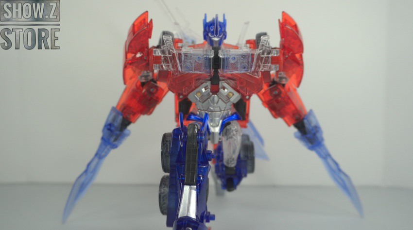 Clear blue variant in robot mode with red accents Clear blue variant in robot mode with red accents
