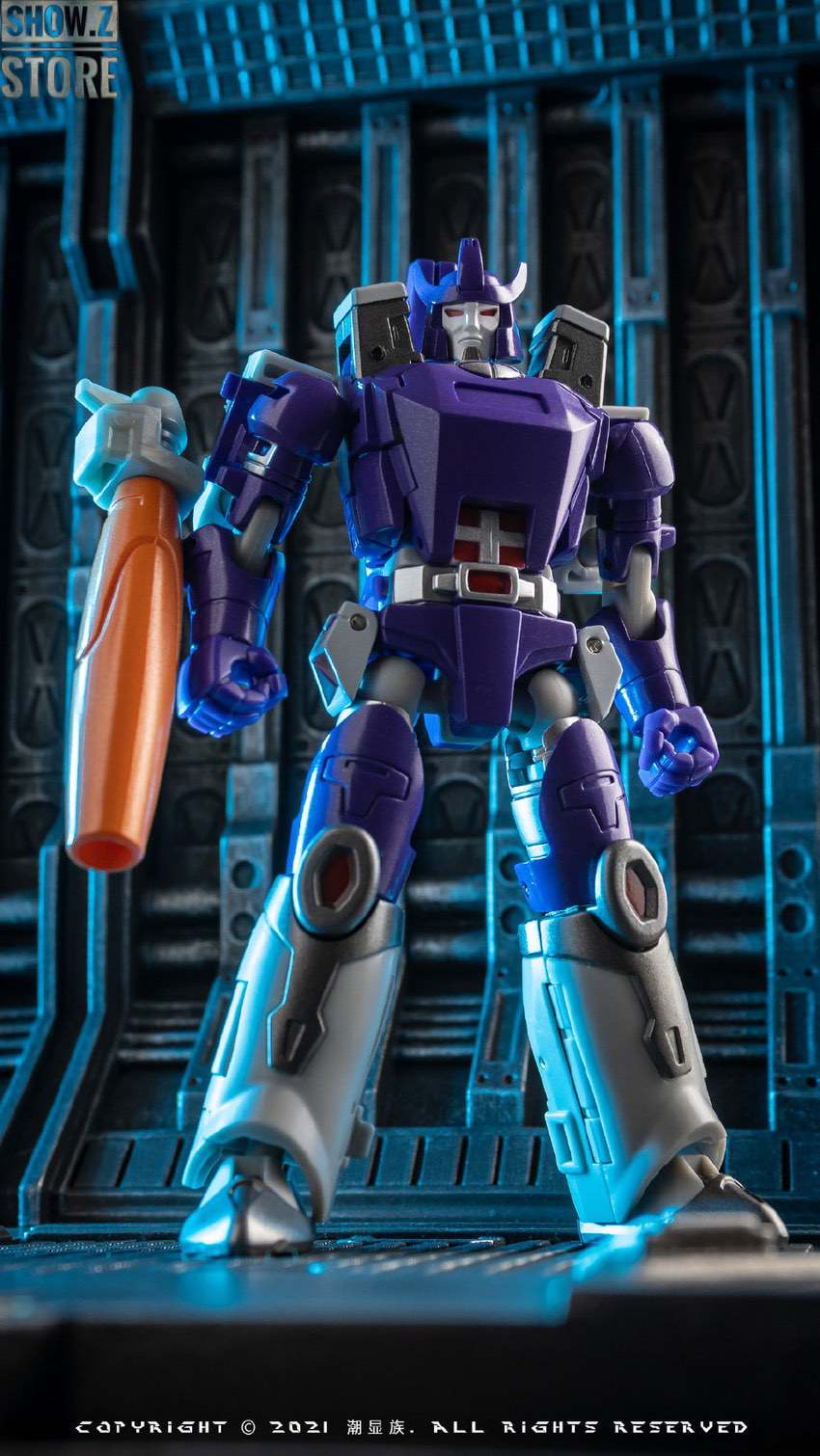 Purple robot figure with orange weapon standing posed Purple robot figure with orange weapon standing posed