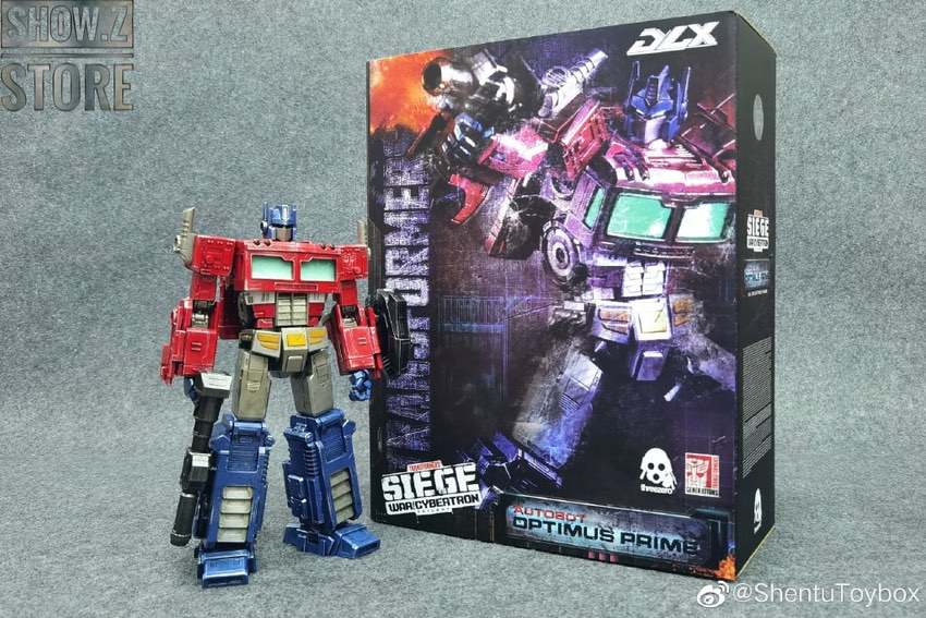 Optimus Prime DLX robot front view with blue eyes glowing Optimus Prime DLX robot front view with blue eyes glowing