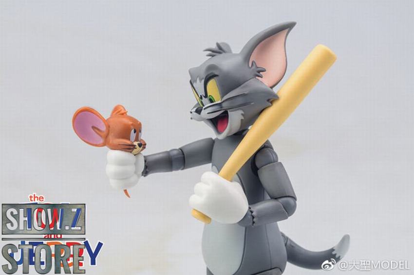 Tom holding Jerry in playful interaction pose Tom holding Jerry in playful interaction pose