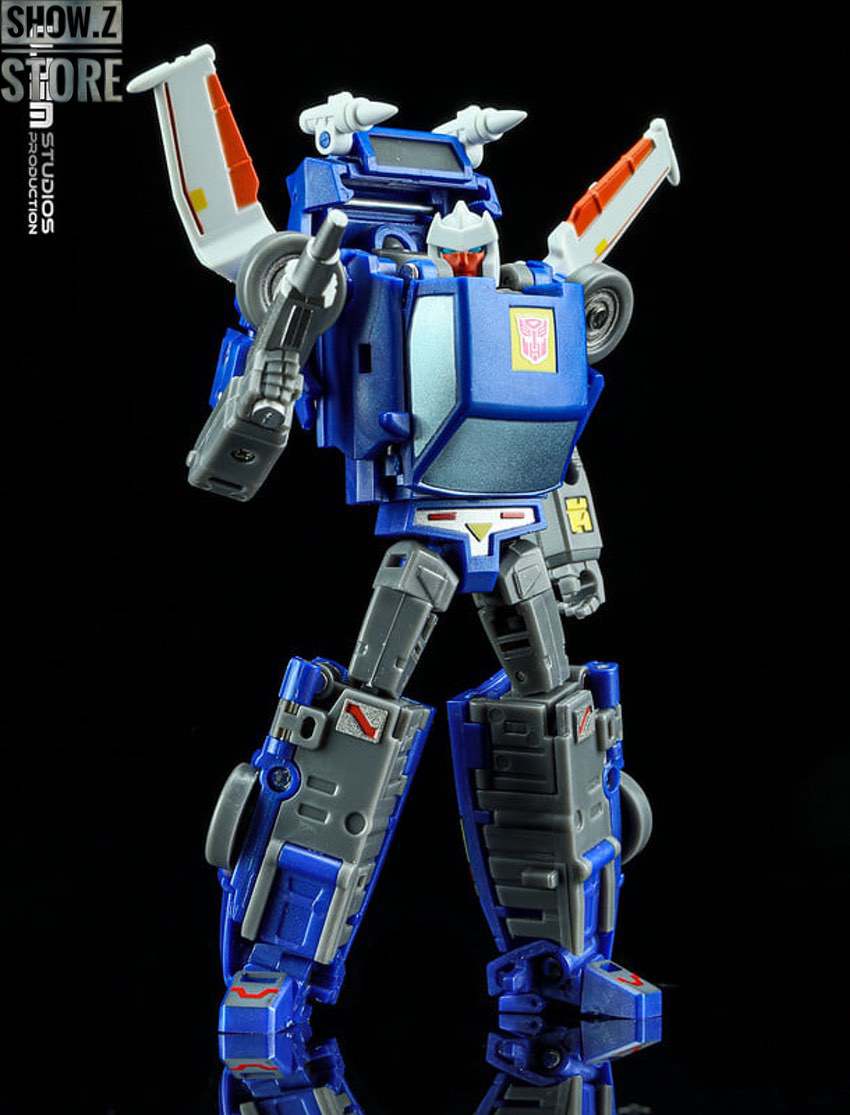 Blue robot figure with panel details in dynamic fighting stance Blue robot figure with panel details in dynamic fighting stance