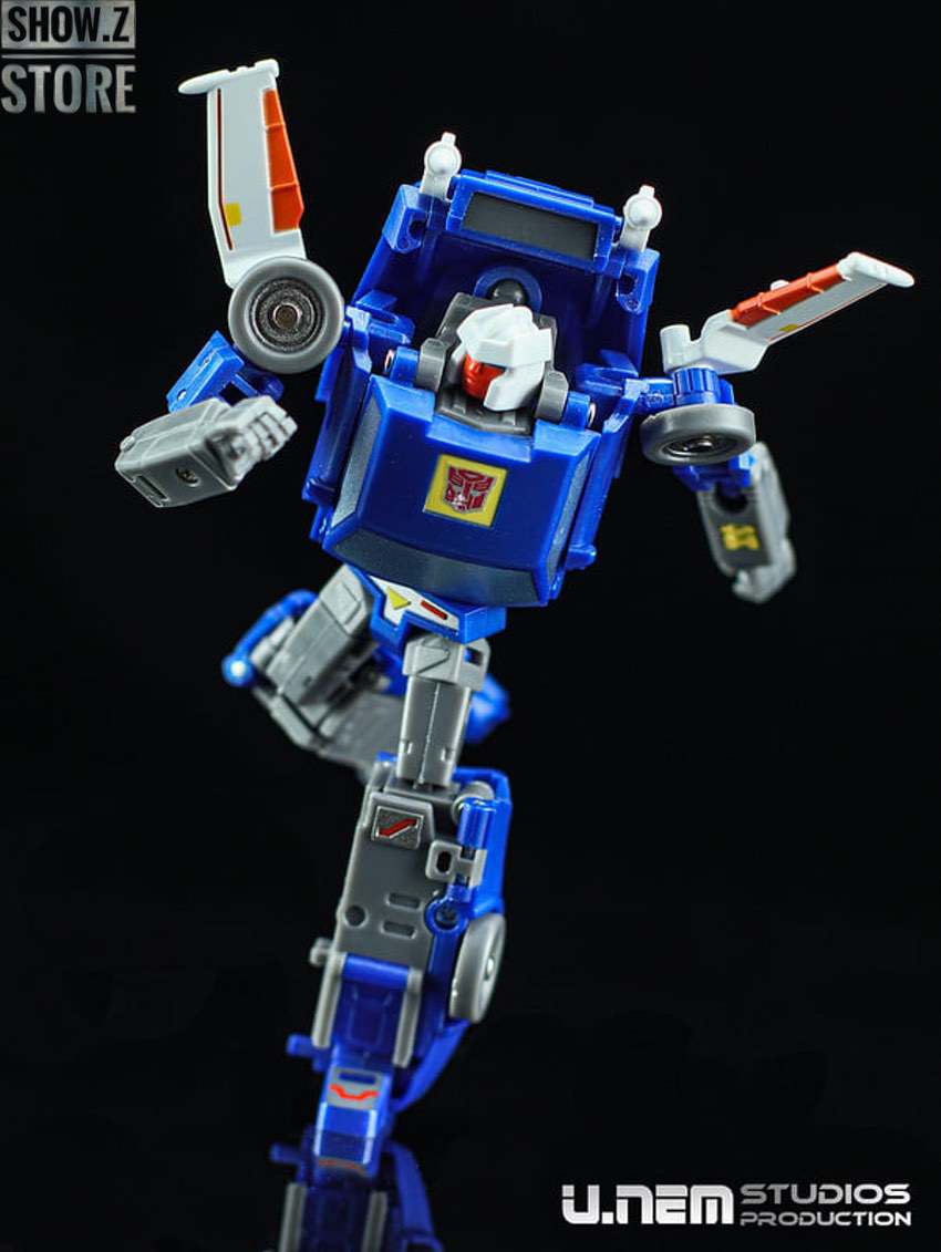 Blue robot with white pilot figure and red and white wings extended Blue robot with white pilot figure and red and white wings extended