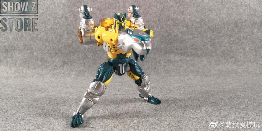 Cheetor figure with articulated limbs holding large cannon weapon on rocky base Cheetor figure with articulated limbs holding large cannon weapon on rocky base