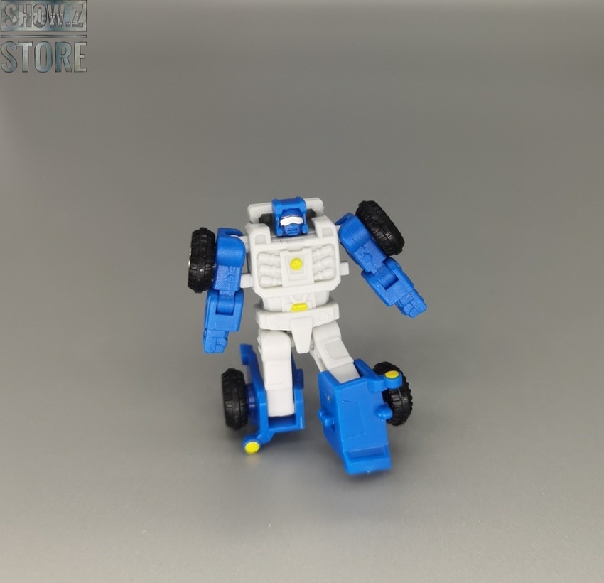 Blue white robot in alternate form with weapon Blue white robot in alternate form with weapon