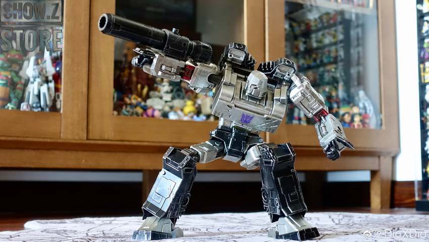 Megatron robot with cannon raised in action pose Megatron robot with cannon raised in action pose