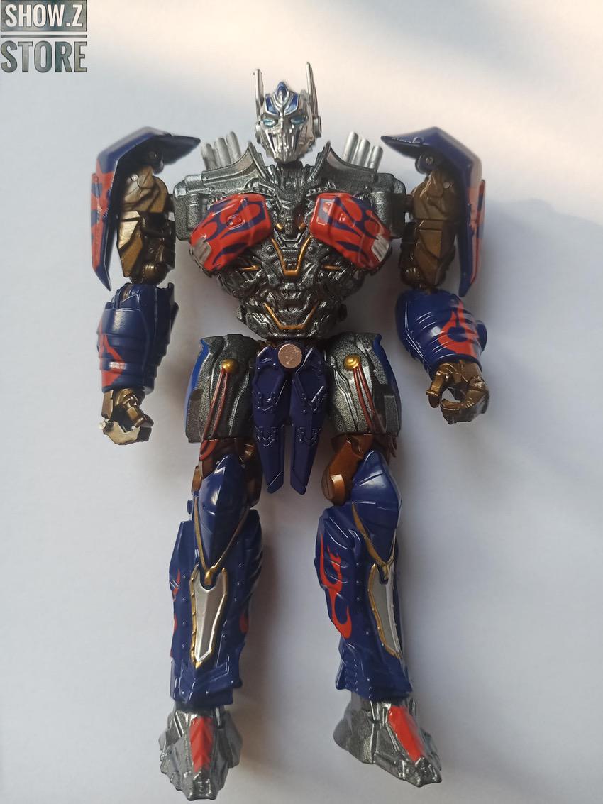 Metallic blue and gold robot in neutral standing position with weapon set Metallic blue and gold robot in neutral standing position with weapon set