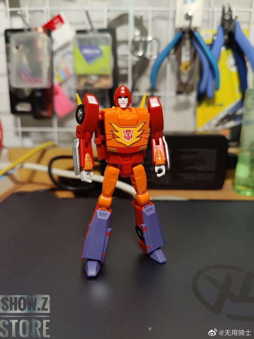 Red and yellow Flame Walker robot in standing pose with weapons Red and yellow Flame Walker robot in standing pose with weapons