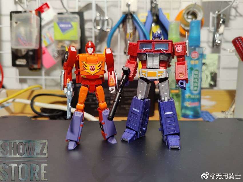 Flame Walker and truck robot figures posed together side by side Flame Walker and truck robot figures posed together side by side