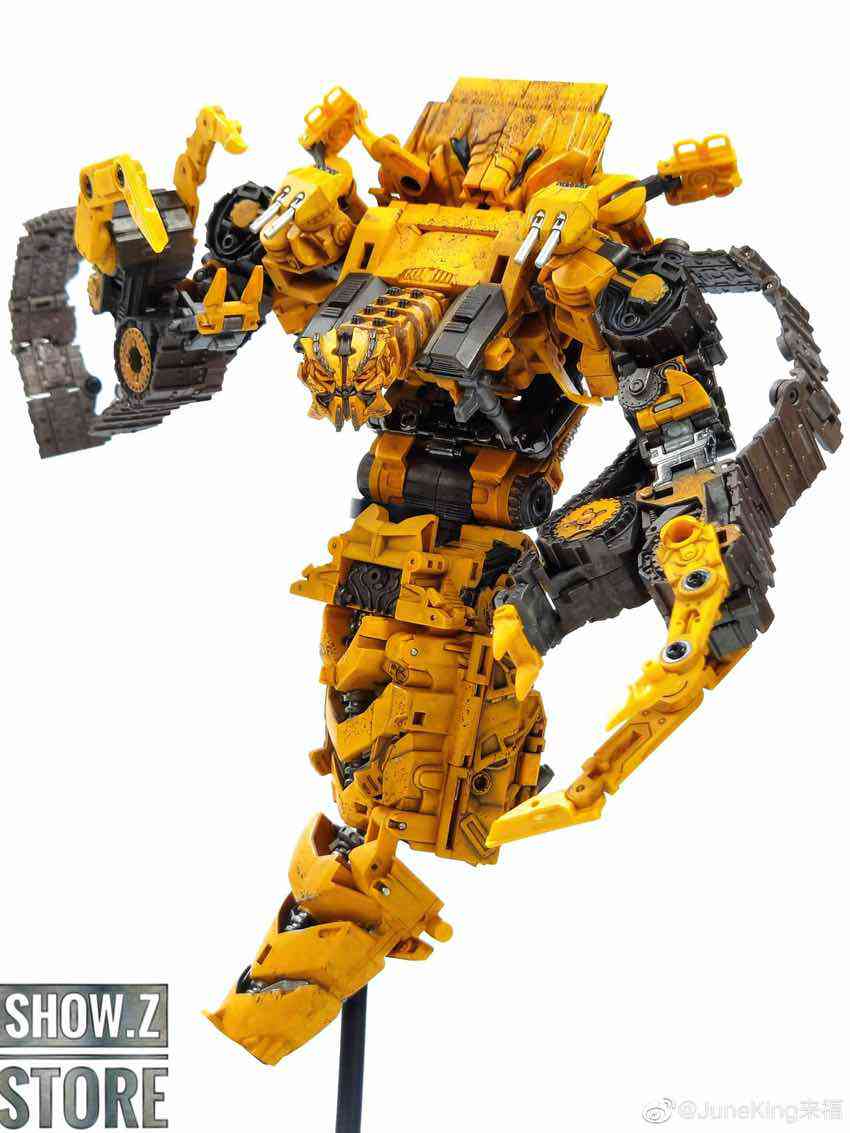 Yellow construction robot with extended arm segments showing mechanical articulation Yellow construction robot with extended arm segments showing mechanical articulation