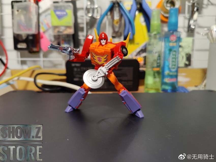 Flame Walker robot in action pose wielding circular weapon Flame Walker robot in action pose wielding circular weapon